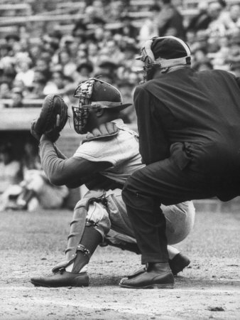 Dodger's Catcher Roy Campanella Catching An Incoming Ball While Umpire Is Stooping Behind Him by John Dominis Pricing Limited Edition Print image