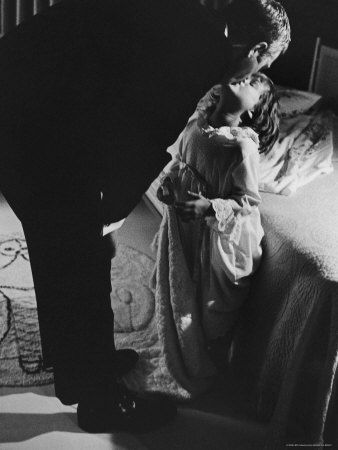 Actor Steve Mcqueen Kissing Daughter Goodnight At Home by John Dominis Pricing Limited Edition Print image