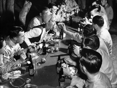 American Soldier Feeding Hollywood Star Dorothy Lamour During Party In Her Honor by William C. Shrout Pricing Limited Edition Print image