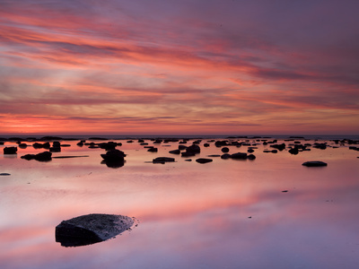 Boulders And Reflections In The Sea At Sunrise, Saltwick Bay, Yorkshire, England, United Kingdom, E by Lizzie Shepherd Pricing Limited Edition Print image