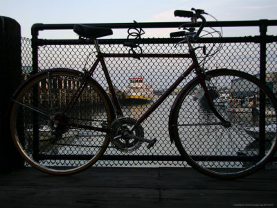 Historic Portland Waterfront View Framed By A Visitors Bicycle by Stephen St. John Pricing Limited Edition Print image