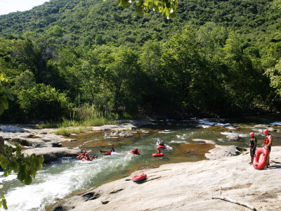 Tourists Doing White Water Tubing In Sabi River, Mpumalanga, South Africa by Roger De La Harpe Pricing Limited Edition Print image