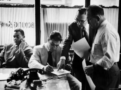 Boxer Rocky Marciano Signing A Contract For A Fight While Joe Louis Looks The Other Way by Al Fenn Pricing Limited Edition Print image