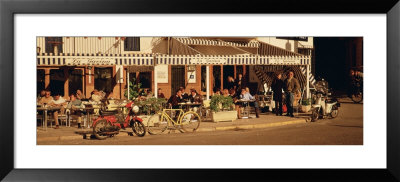 Tourists Sitting In A Cafe, Sitges Beach, Catalonia, Spain by Panoramic Images Pricing Limited Edition Print image