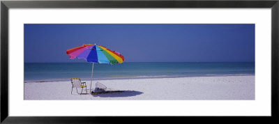 Beach Umbrella And A Folding Chair On The Beach, Fort De Soto Park, Tierra Verde, Florida, Usa by Panoramic Images Pricing Limited Edition Print image
