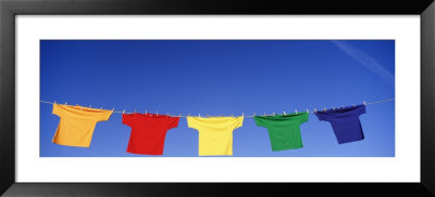 Low Angle View Of T-Shirts Hanging On A Clothesline by Panoramic Images Pricing Limited Edition Print image