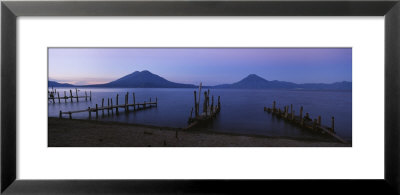 Piers Over A Lake, Guatemala by Panoramic Images Pricing Limited Edition Print image
