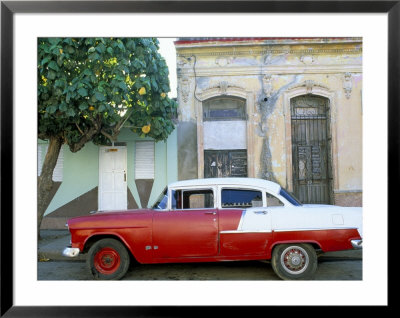 Old American Car Parked Beneath Fruit Tree, Cienfuegos, Cuba, West Indies, Central America by Lee Frost Pricing Limited Edition Print image