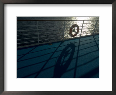 Life Preserver Hanging On A Railing Of A Cruise Ship Deck by Todd Gipstein Pricing Limited Edition Print image