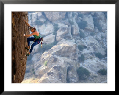 A Man Climbing A Rock Face At Hueco Tanks by Bill Hatcher Pricing Limited Edition Print image