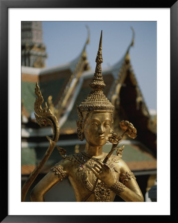 A Golden Buddha Statue Stands Outside The Grand Palace In Bangkok by Jodi Cobb Pricing Limited Edition Print image