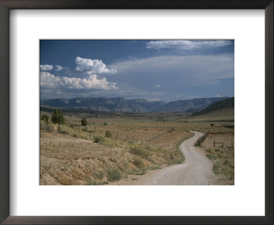 Dirt Road To A Ranch In The Desert Hills Near The Grand Canyon by Todd Gipstein Pricing Limited Edition Print image