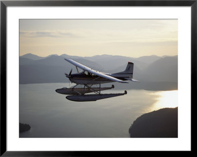 A Seaplane Takes A Sightseeing Tour Over Misty Fjord by Bill Curtsinger Pricing Limited Edition Print image