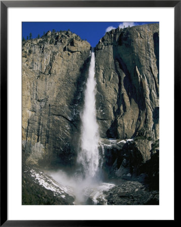 A Waterfall In Yosemite National Park by Paul Nicklen Pricing Limited Edition Print image
