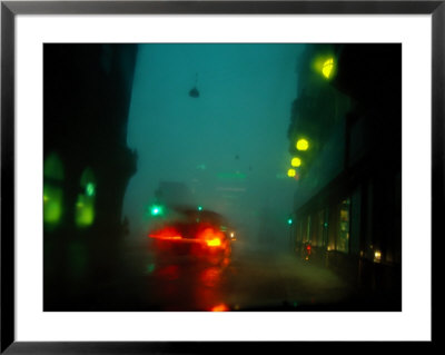Misty View Of Car Lights On A City Street During A Rain Storm by Sisse Brimberg Pricing Limited Edition Print image