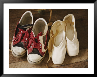 A Pair Of Tennis Shoes With Red Laces Sits Next To A Pair Of Ballet Slippers by Jodi Cobb Pricing Limited Edition Print image