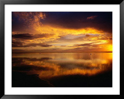 The Setting Sun Casts Light On Dark Clouds And Sea, Cook Islands by Peter Hendrie Pricing Limited Edition Print image