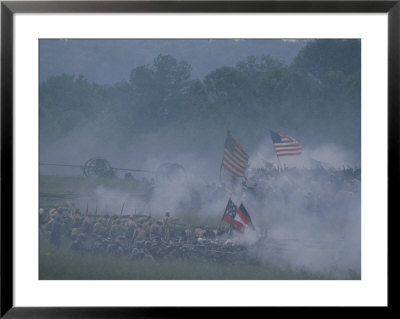 Flags, Soldiers, And Gun Smoke During A Civil War Reenactment by Kenneth Garrett Pricing Limited Edition Print image