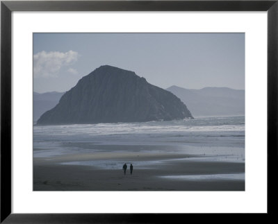 Two People Walk Along A Beach Near Morro Rock by Marc Moritsch Pricing Limited Edition Print image