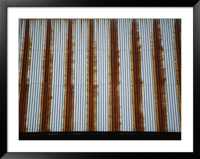 Lines Of Rust Make A Bold Pattern Across An Old Corrugated Barn Roof by Stephen St. John Pricing Limited Edition Print image