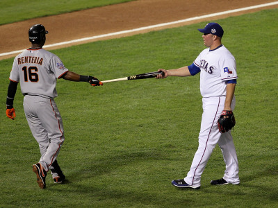 San Francisco Giants V Texas Rangers, Game 4: Tommy Hunter,Edgar Renteria by Stephen Dunn Pricing Limited Edition Print image