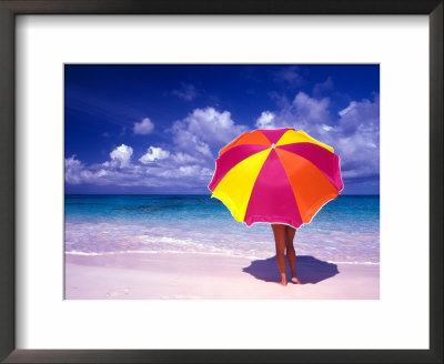 Female Holding A Colorful Beach Umbrella On Harbour Island, Bahamas by Greg Johnston Pricing Limited Edition Print image