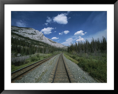 Train Tracks Winding Their Way Through The Canadian Rockies by Todd Gipstein Pricing Limited Edition Print image