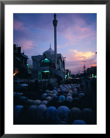 People Praying On Street Outide Mosque, Peshawar, Pakistan by Richard I'anson Pricing Limited Edition Print image