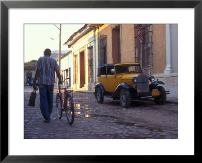 A Man Walks Down The Cobblestoned Street Of This Tropical Island, Trinidad, Cuba by Taylor S. Kennedy Pricing Limited Edition Print image