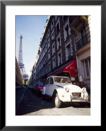 Parked Citroen On Rue De Monttessuy, With The Eiffel Tower Behind, Paris, France by Geoff Renner Pricing Limited Edition Print image
