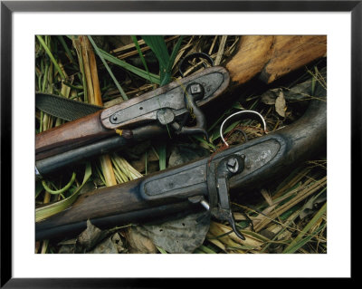 A Pair Of Old Flint-Type Rifles Lying On The Ground by Steve Winter Pricing Limited Edition Print image