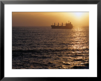 Cargo Ship At Sea Silhouetted At Sunset, Chile by Brent Winebrenner Pricing Limited Edition Print image