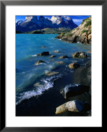 Rocks And Water Of Lago Pehoe And The Cuernos Del Paine In Distance, Chile by Brent Winebrenner Pricing Limited Edition Print image