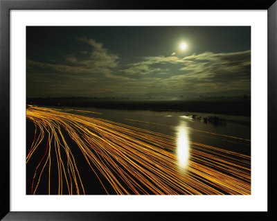 Time Lapse Of Lights From Boats Moving On Water by Steve Winter Pricing Limited Edition Print image
