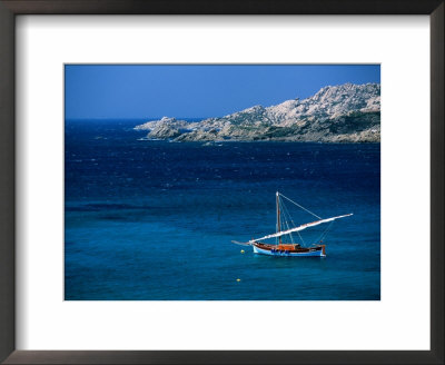 Traditional Sailboat On Rocky Coast Of Island, Sassari, Maddalena, Sardinia, Italy by Dallas Stribley Pricing Limited Edition Print image