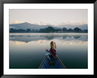 A Woman Stares At The Distant Annapurna Range From A Rowboat by Skip Brown Pricing Limited Edition Print image