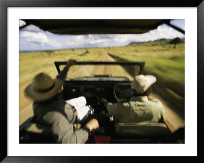 Wildlife Seekers In A Jeep On A Game Drive by Michael Melford Pricing Limited Edition Print image