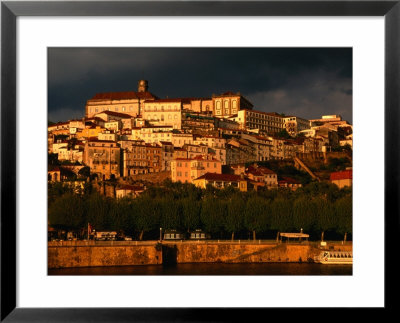 Dark Clouds At Sunset Hang Over The Velha Universidade (Old University) Of Coimbra, Portugal by Anders Blomqvist Pricing Limited Edition Print image
