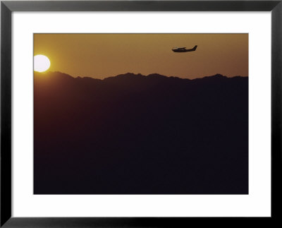 A Cessna 210 Soars Above Olympic National Forests Shelton And Quinault Ranger Districts by Joel Sartore Pricing Limited Edition Print image