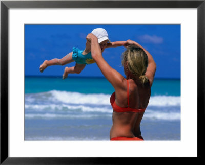 Mother Swinging Baby On Varadero Beach, Varadero, Cuba by Philip Smith Pricing Limited Edition Print image