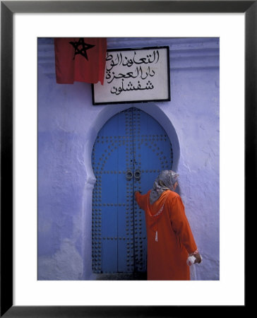 Woman Exits Thru Moorish-Style Blue Door, Morocco by John & Lisa Merrill Pricing Limited Edition Print image