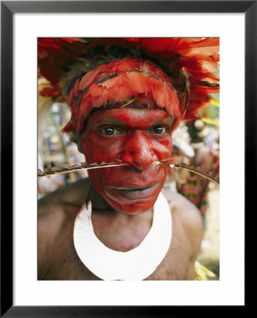An Am-Kopei Clansmen Follows Tradition By Painting His Face Bright Red And Wearing Many Ornaments by Jodi Cobb Pricing Limited Edition Print image
