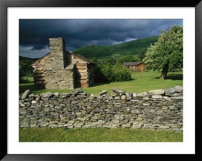 Storm Clouds Form Above Log Buildings On The Site Of French Azilum by Raymond Gehman Pricing Limited Edition Print image