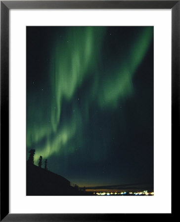 The Aurora Borealis Creates Beautiful Patterns In The Night Sky by Paul Nicklen Pricing Limited Edition Print image