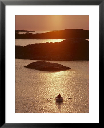 Rowboat Heads Toward A Series Of Low-Lying Islands At Twilight by Thomas J. Abercrombie Pricing Limited Edition Print image