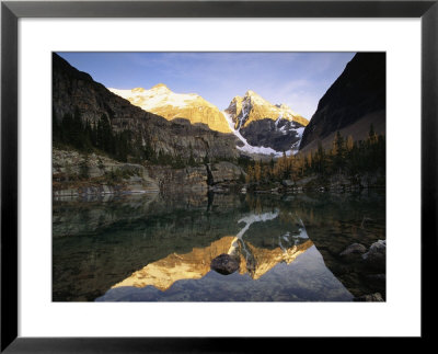 Alpenglow Illuminates Glacier And Ringrose Peaks by Raymond Gehman Pricing Limited Edition Print image