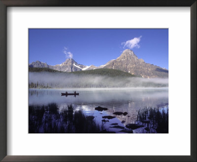 Fishermen In Canoe On Waterfowl Lake, Banff National Park, Canada by Janis Miglavs Pricing Limited Edition Print image