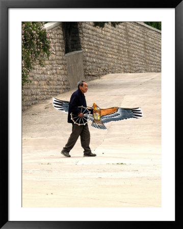 Man With A Bird Kite, 1000 Buddhas Mountain, Qian Fo Shan, Shandong Province, Jinan, China by Bruce Behnke Pricing Limited Edition Print image