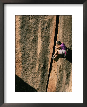 A Woman Climbs A Crack In A Cliff Face by Bill Hatcher Pricing Limited Edition Print image