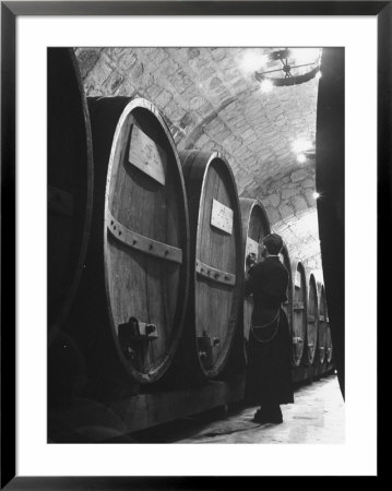 Jesuit Novitiate Winery, Oak Casks Of Wine In Underground Tunnel Of Winery by Charles E. Steinheimer Pricing Limited Edition Print image